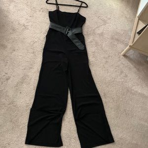 Sophisticated, belted jumpsuit with pockets and slits at the ankles.